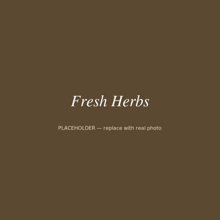 Hands sorting freshly picked herbs